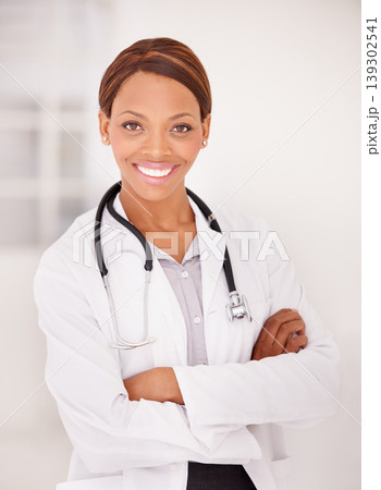 Doctor, woman portrait and arms crossed for professional career, happy services and confidence in clinic or hospital. Smile of african expert or medical worker with healthcare solution and integrity 139302541