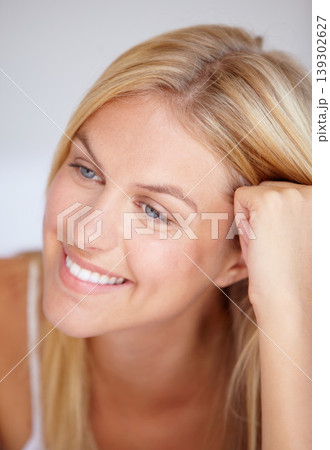 Closeup, happy woman and face for thinking in home, peaceful and calm with vision for future. Female person, smile and joyful expression on face with nostalgia, relaxing or alone by quiet in bedroom 139302627