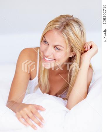 Face, happy woman and smile for thinking in home, peaceful and calm with vision for future. Female person, hand and casual hairstyle with joyful expression for nostalgia, relaxing or alone by quiet 139302719