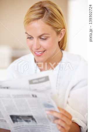 Woman, smile and newspaper for reading in home for knowledge, information and world news. Female person, happy and face for article, headline and story in publication for daily, update and review Woman, smile and newspaper for reading in home for knowledge, information and world news. Female person, happy and face for article, headline and story in publication for daily, update and review 139302724
