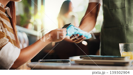 Hands, credit card and waiter with machine at cafe, order or sale with customer experience at diner. People, server and tap with easy payment in coffee shop, fintech and pos with bills at restaurant Hands, credit card and waiter with machine at cafe, order or sale with customer experience at diner. People, server and tap with easy payment in coffee shop, fintech and pos with bills at restaurant 139302904