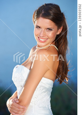 Bride, portrait and smile outdoor for love, commitment and celebration ceremony with confidence. Jewelry, woman and happy from future marriage, romance and formal event in a garden with a dress 139303502