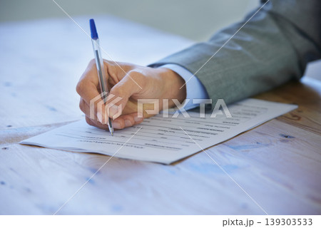 Closeup, writing and business with man, paperwork and insurance with signature, contract and application. Person, employee or worker with hands and checklist with compliance, resume or agreement 139303533