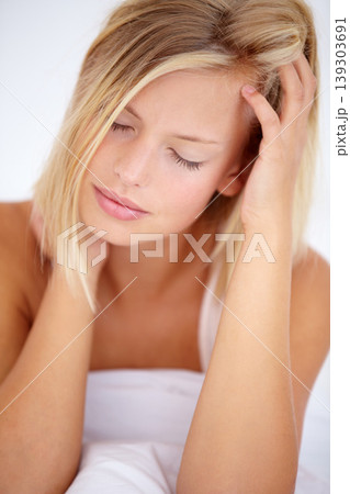 Person, morning and headache in home bedroom for depression, anxiety and burnout fail. Stress, frustrated and tired woman in house for mental health, migraine and pain from mistake, crisis and trauma Person, morning and headache in home bedroom for depression, anxiety and burnout fail. Stress, frustrated and tired woman in house for mental health, migraine and pain from mistake, crisis and trauma 139303691