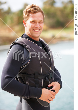 Man, ready and life jacket at lake, summer or portrait for extreme sports for fitness, exercise or workout. Person, happy and safety vest by river, nature or smile for pride, health or start training Man, ready and life jacket at lake, summer or portrait for extreme sports for fitness, exercise or workout. Person, happy and safety vest by river, nature or smile for pride, health or start training 139303695