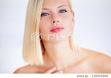 Woman, skincare and touch in studio portrait for wellness, beauty and health by white background. Girl, model and facial change for skin, cosmetic care and transformation with pride for natural glow Woman, skincare and touch in studio portrait for wellness, beauty and health by white background. Girl, model and facial change for skin, cosmetic care and transformation with pride for natural glow 139303800