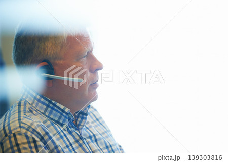 Businessman, face and headphones at call center for customer service, telemarketing or support at office. Mature man, consultant or agent ready for online advice or help on mockup space at workplace Businessman, face and headphones at call center for customer service, telemarketing or support at office. Mature man, consultant or agent ready for online advice or help on mockup space at workplace 139303816