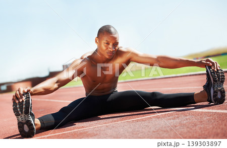 Man, athlete and stretching legs on floor, outdoors and fitness for health, sports and performance. Black male person, ready and warmup on track, workout and commitment in training, start and cardio 139303897