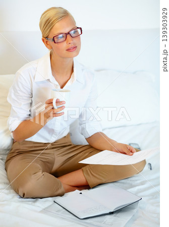 Remote work from home, thinking and woman with documents, planning and problem solving. Person, bedroom and entrepreneur with paperwork, solutions and freelancer with ideas, copywriting and coffee Remote work from home, thinking and woman with documents, planning and problem solving. Person, bedroom and entrepreneur with paperwork, solutions and freelancer with ideas, copywriting and coffee 139303929