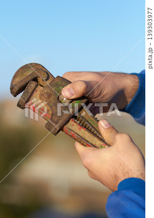 Hand, mechanic and wrench tool closeup for maintenance or repair, helping or hardware. Man, spanner and engineer for car service job or improvement for fixing at garage, steel workshop for automobile Hand, mechanic and wrench tool closeup for maintenance or repair, helping or hardware. Man, spanner and engineer for car service job or improvement for fixing at garage, steel workshop for automobile 139303977
