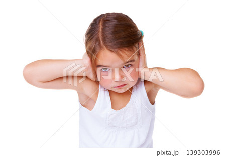 Portrait, loud and covering ears with a girl child in studio isolated on a white background to stop noise. Face, stress or sound with an unhappy young kid using her hands to block hearing for silence Portrait, loud and covering ears with a girl child in studio isolated on a white background to stop noise. Face, stress or sound with an unhappy young kid using her hands to block hearing for silence 139303996