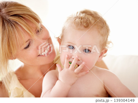 Love, hug and mother with baby on a sofa for playing, games or bonding in their home together. Family, face and boy kid with parent in a living room having fun with building blocks, toys or learning Love, hug and mother with baby on a sofa for playing, games or bonding in their home together. Family, face and boy kid with parent in a living room having fun with building blocks, toys or learning 139304149