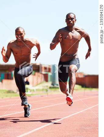 Man, athlete and running and competitive for race on track with practice for competition. Black people, together and passion for sport with dedication, motivation or determination on face for winning Man, athlete and running and competitive for race on track with practice for competition. Black people, together and passion for sport with dedication, motivation or determination on face for winning 139304170