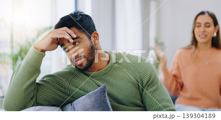Couple, home and fight on sofa, sad and angry with stress, mental health and headache with relationship crisis. Man, woman and together on lounge couch with conflict, anxiety and mistake in marriage Couple, home and fight on sofa, sad and angry with stress, mental health and headache with relationship crisis. Man, woman and together on lounge couch with conflict, anxiety and mistake in marriage 139304189