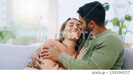 Hug, kiss and couple on a sofa with love, relax and security at home bonding, hanging out or chilling. Happy, support and people in a living room with trust, commitment and gratitude, care or romance Hug, kiss and couple on a sofa with love, relax and security at home bonding, hanging out or chilling. Happy, support and people in a living room with trust, commitment and gratitude, care or romance 139304257