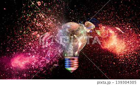 real Light bulb exploding creating colorful glass fragments real Light bulb exploding creating colorful glass fragments 139304305