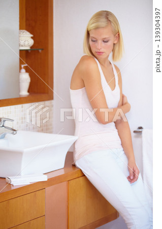 Worry, anxiety and woman with pregnancy test in bathroom waiting for results, news and information. Motherhood, pregnant and sad person with medical testing kit for fertility or ovulation at home Worry, anxiety and woman with pregnancy test in bathroom waiting for results, news and information. Motherhood, pregnant and sad person with medical testing kit for fertility or ovulation at home 139304397