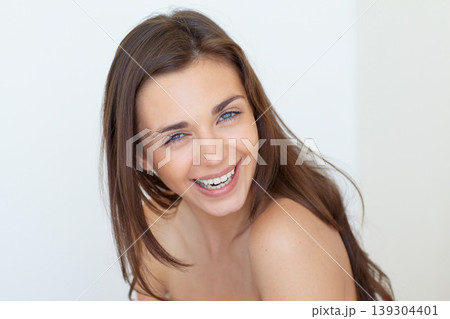 Portrait, smile and beauty with a woman laughing in studio on a white background for natural skincare. Face, aesthetic or funny and a happy person looking confident with her antiaging skin routine 139304401