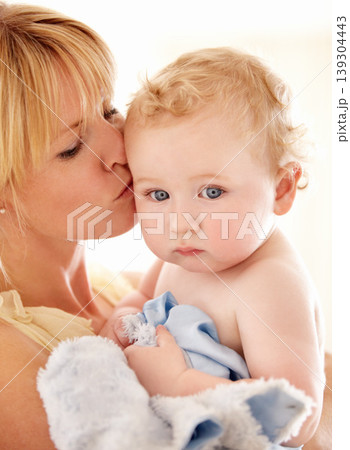 Love, kiss and face of baby with mother in a house for bonding, playing or care, trust or growth. Family, support and mom embrace boy kid in their home for child development, security or having fun Love, kiss and face of baby with mother in a house for bonding, playing or care, trust or growth. Family, support and mom embrace boy kid in their home for child development, security or having fun 139304443