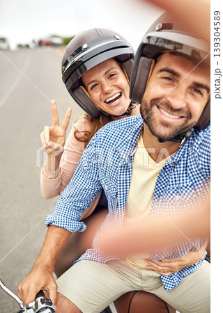 Couple, peace sign and smile in selfie, hand and road trip or vacation, scooter and embrace in portrait. Happy people, freedom and emoji or icon in outdoors, travel and face or tourism with helmet Couple, peace sign and smile in selfie, hand and road trip or vacation, scooter and embrace in portrait. Happy people, freedom and emoji or icon in outdoors, travel and face or tourism with helmet 139304589