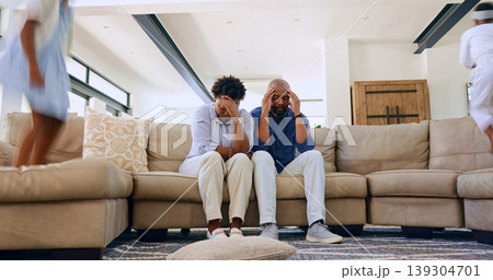 Children, jump or tired parents with headache on sofa with stress, anxiety or fatigue at home. Family, chaos or frustrated people in living room with hyper kids, burnout or overwhelmed by adhd energy Children, jump or tired parents with headache on sofa with stress, anxiety or fatigue at home. Family, chaos or frustrated people in living room with hyper kids, burnout or overwhelmed by adhd energy 139304701