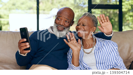 Happy senior couple, video call and smartphone in home for voip communication, social network or chat. African man, woman and wave hello for virtual conversation, mobile contact or talk in retirement 139304714