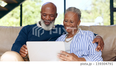 Hug, love and senior couple with laptop on sofa for streaming, search or subscription discussion at home. Happy, relax and elderly people in a living room online with social media, sign up or choice 139304791