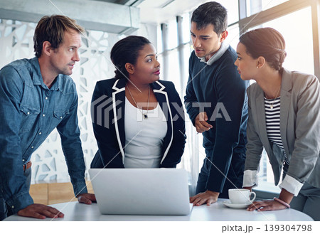 Meeting, laptop and a business team in the office together for collaboration to discuss strategy. Computer, planning or brainstorm with an employee group of men and women in a workplace for research 139304798