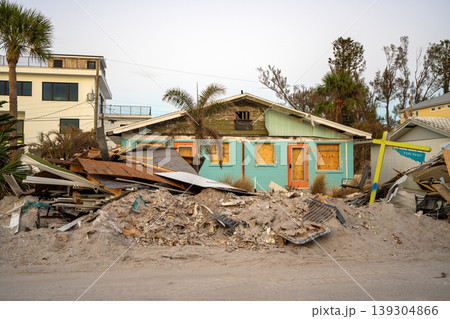 Hurricane Milton aftermath cleanup. Piles of debris and sand on street side on Manasota Key in Florida Hurricane Milton aftermath cleanup. Piles of debris and sand on street side on Manasota Key in Florida 139304866