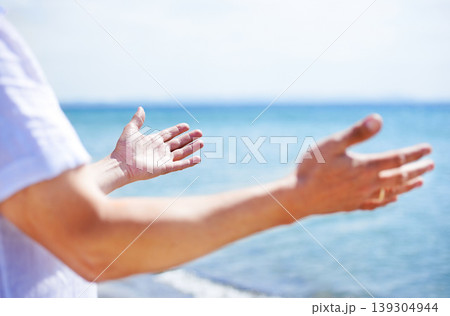 Hands, worship and man at the sea with happiness and praise God for blessing, water and spiritual peace. Person, closeup or respect Jesus Christ with gratitude, freedom and hope at the ocean or beach Hands, worship and man at the sea with happiness and praise God for blessing, water and spiritual peace. Person, closeup or respect Jesus Christ with gratitude, freedom and hope at the ocean or beach 139304944