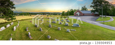 Grave tombstones at old cemetery in small town America. Death concept Grave tombstones at old cemetery in small town America. Death concept 139304953