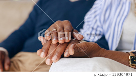 Elderly couple, love and holding hands for trust, emotional healing or support partner for empathy at home. Closeup, senior people and touch hand for care, kindness or gratitude of hope in retirement Elderly couple, love and holding hands for trust, emotional healing or support partner for empathy at home. Closeup, senior people and touch hand for care, kindness or gratitude of hope in retirement 139304971