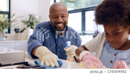 Father, daughter and cleaning with glove in kitchen for bonding, happiness and teaching in home or house. Black family, man and girl child with cloth, liquid detergent and table with smile and care Father, daughter and cleaning with glove in kitchen for bonding, happiness and teaching in home or house. Black family, man and girl child with cloth, liquid detergent and table with smile and care 139304982