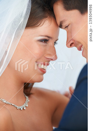 Love, happy couple embrace and wedding with love, care and commitment at reception. Smile, face of woman and man hugging at marriage celebration with romance, loyalty and hope for future together. 139304998