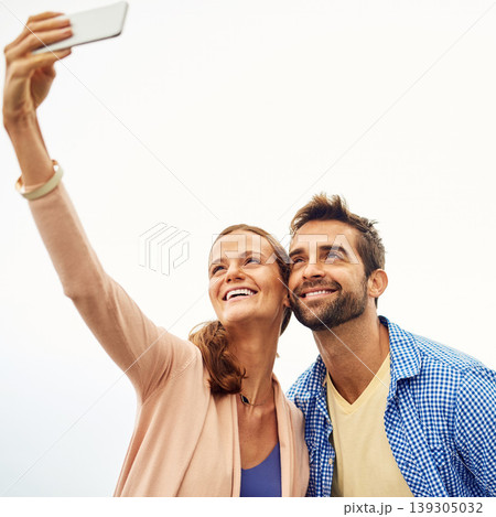 Couple, phone and selfie on holiday, smile and outdoors on adventure, love and memories for social media. Happy people, smartphone and bonding or technology, travel and vacation or profile picture Couple, phone and selfie on holiday, smile and outdoors on adventure, love and memories for social media. Happy people, smartphone and bonding or technology, travel and vacation or profile picture 139305032
