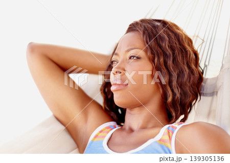 Thinking, black woman and stress with hammock and relax in studio with modern and casual fashion. Idea, memory and lying down with a African female person with day dreaming and wondering with style Thinking, black woman and stress with hammock and relax in studio with modern and casual fashion. Idea, memory and lying down with a African female person with day dreaming and wondering with style 139305136