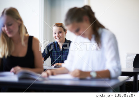 College student, portrait and learning with notes in class, lecture or people in education. University, classroom and face of happy woman with notebook, knowledge and studying in academy or school 139305207