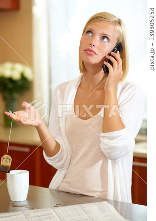Woman, phone call and conversation in kitchen, news and communication on technology at home. Female person, smartphone and discussion or tea, connection and newspaper or newsletter, chat and talk Woman, phone call and conversation in kitchen, news and communication on technology at home. Female person, smartphone and discussion or tea, connection and newspaper or newsletter, chat and talk 139305258