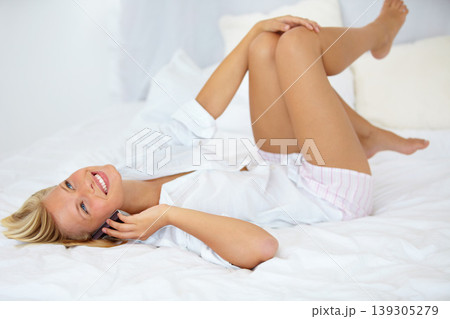 Smile, phone call and young woman on bed in the morning in her modern apartment or home. Excited, happy and female person from Australia on mobile conversation with cellphone in bedroom at house. Smile, phone call and young woman on bed in the morning in her modern apartment or home. Excited, happy and female person from Australia on mobile conversation with cellphone in bedroom at house. 139305279