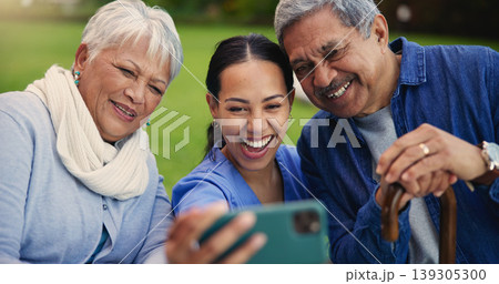 Happy woman, doctor and senior couple in selfie for photography, elderly care or retirement in nature. Medical nurse or caregiver smile with mature people for picture, photograph or memory at park Happy woman, doctor and senior couple in selfie for photography, elderly care or retirement in nature. Medical nurse or caregiver smile with mature people for picture, photograph or memory at park 139305300