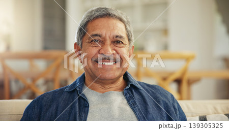 Portrait, senior man and smile in home to relax for retirement, confidence and good mood. Happy face, elderly guy and pensioner on sofa in living room with wisdom, old age and optimism in Colombia 139305325