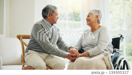 Love, retirement and an old woman in a wheelchair with her husband in the living room of their home together. Trust, support and an elderly man talking to his wife with a disability in the apartment Love, retirement and an old woman in a wheelchair with her husband in the living room of their home together. Trust, support and an elderly man talking to his wife with a disability in the apartment 139305327