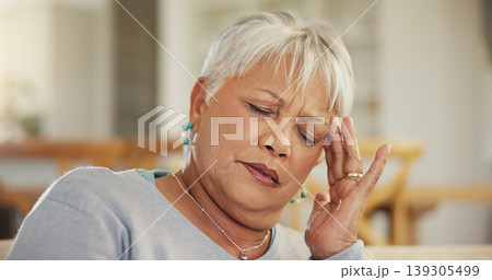 Headache, senior woman and stress in home for retirement, mental health and anxiety of brain fog. Face, sad and frustrated elderly lady with migraine, crisis and pain of vertigo, trauma and fatigue 139305499