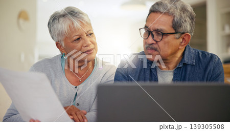 Senior couple, laptop and documents in home for budget, planning financial assets or investment portfolio. Man, woman and paperwork at computer of banking loan, retirement savings or insurance policy Senior couple, laptop and documents in home for budget, planning financial assets or investment portfolio. Man, woman and paperwork at computer of banking loan, retirement savings or insurance policy 139305508