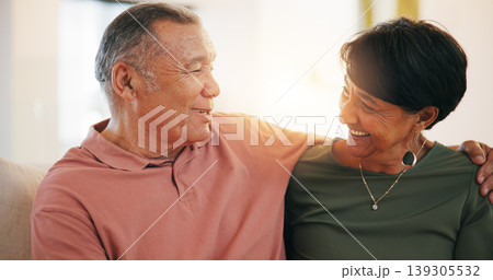 Retirement, couple and hug with love in morning, home or conversation with support in living room. Mature, people and talking together with embrace on sofa in lounge of apartment or vacation in house 139305532
