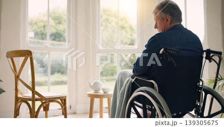 Wheelchair, senior man or thinking of memory by window in nursing home or retirement with depression. Nostalgia, sad history or lonely mature person in lounge by an empty chair to remember past loss Wheelchair, senior man or thinking of memory by window in nursing home or retirement with depression. Nostalgia, sad history or lonely mature person in lounge by an empty chair to remember past loss 139305675