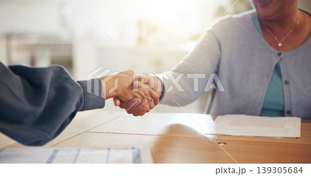 People, handshake and meeting for retirement plan, documents or paperwork in deal or insurance at home. Closeup of senior woman shaking hands with attorney or lawyer for legal agreement at house People, handshake and meeting for retirement plan, documents or paperwork in deal or insurance at home. Closeup of senior woman shaking hands with attorney or lawyer for legal agreement at house 139305684