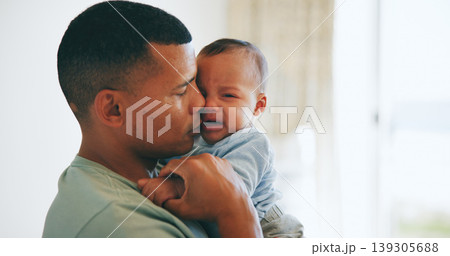 Hug, comfort and father with crying baby in a nursery with care, security and trust at home together. Love, tears and dad embrace upset newborn with colic, stress or discomfort, console or nurture 139305688
