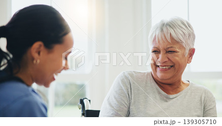 Happy woman, nurse and senior patient laughing in elderly care for funny joke, humor or consultation at old age home. Doctor or medical caregiver smile and laugh with mature person with a disability 139305710
