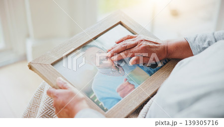 Senior woman, grief and picture of husband on lap, hands and sad of love loss in retirement. Elderly person, alone and dear memory of beloved with anxiety, mental health and lonely bereaved in house Senior woman, grief and picture of husband on lap, hands and sad of love loss in retirement. Elderly person, alone and dear memory of beloved with anxiety, mental health and lonely bereaved in house 139305716